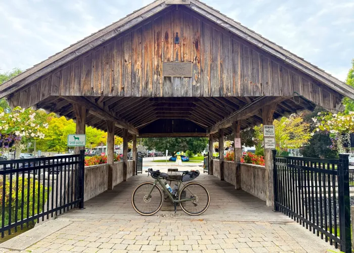 covered bridge with bike leaning against it