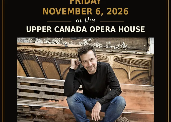 Black background photo of Michael Kaeshammer wearing jeans and black shirt sitting on bench, venue logo and event details